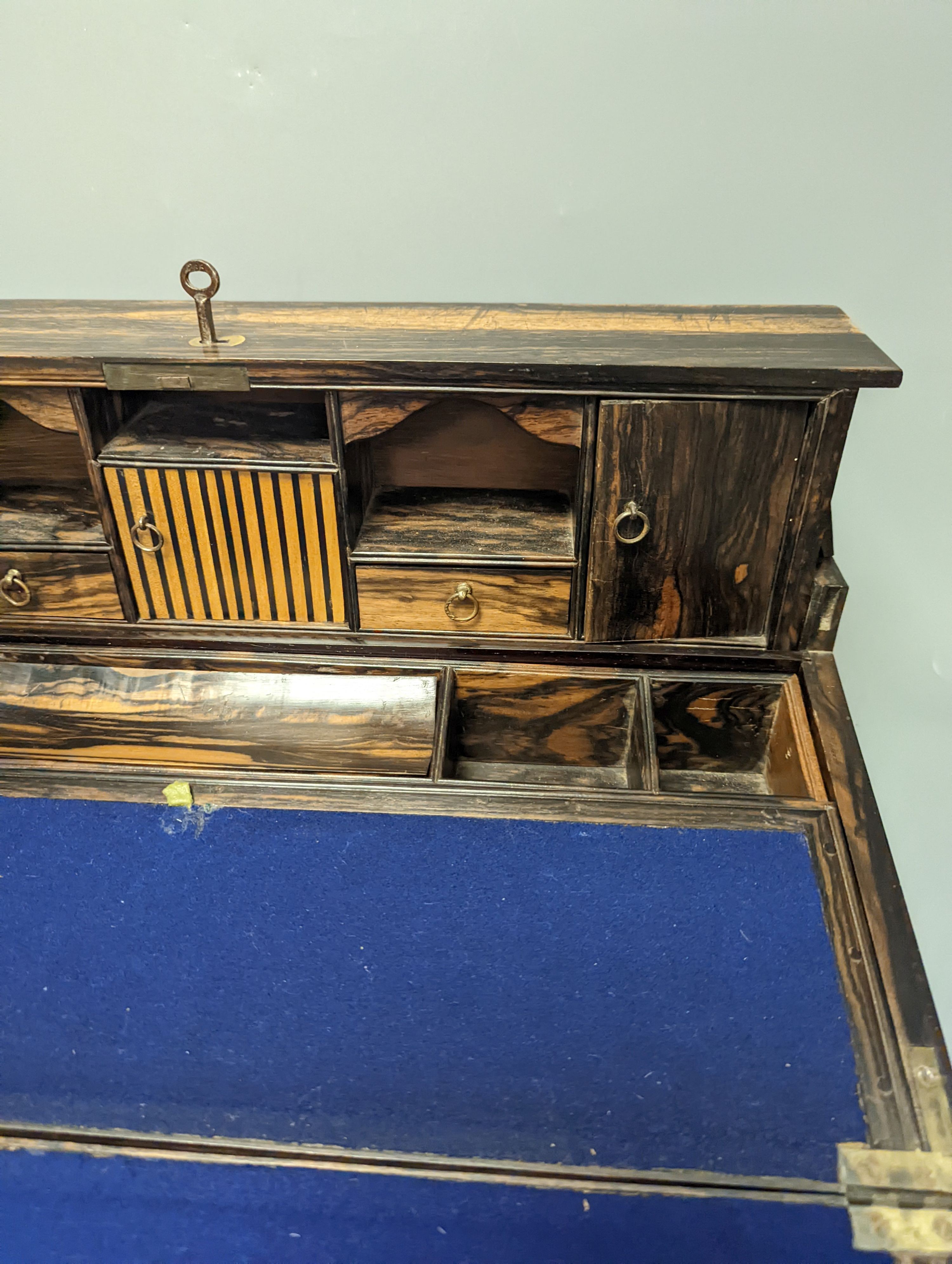 A 19th Anglo-Indian coromandel writing slope, with harlequin action compartmentalised superstructure, 45cm wide